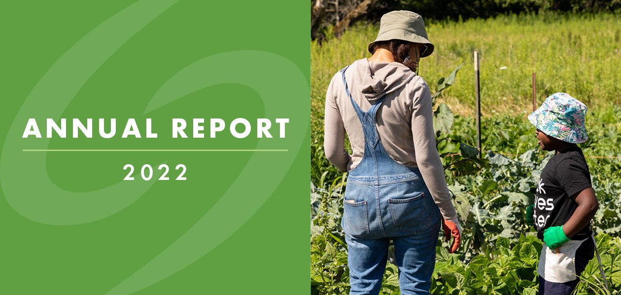 ar-2022-banner Left half says Annual Report 2022 text on a green background and right half has woman and child in a garden